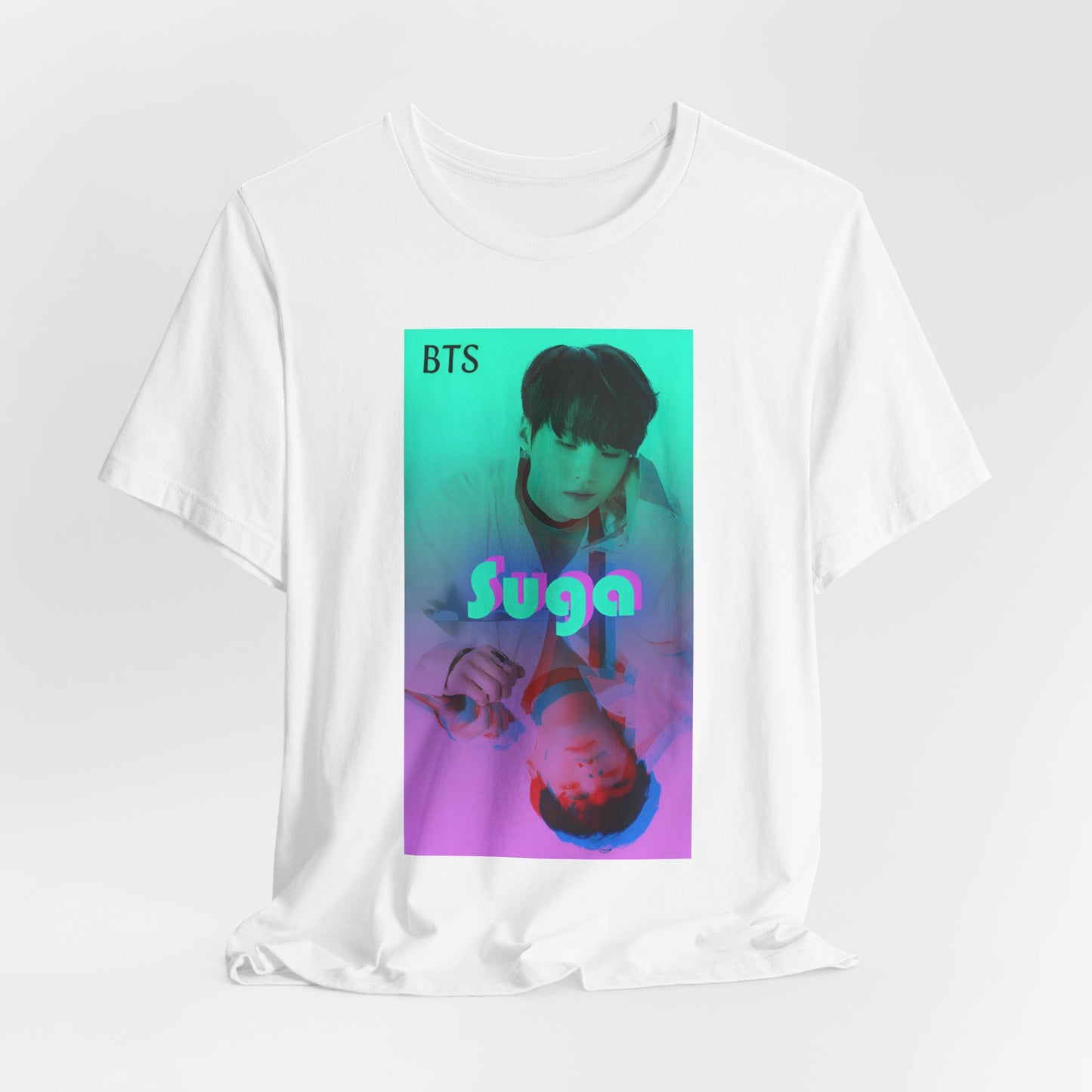 Draped Unisex airlume combed & ring-spun cotton T-shirt in white, featuring Suga of BTS (Agust D) in cyan, looking into a mirror. His lavender reflection appears glitched, starting at his right hand. The surreal gradient and distortion suggest a drifting, dreamlike moment out of sync with reality. From ModeK Vetements.