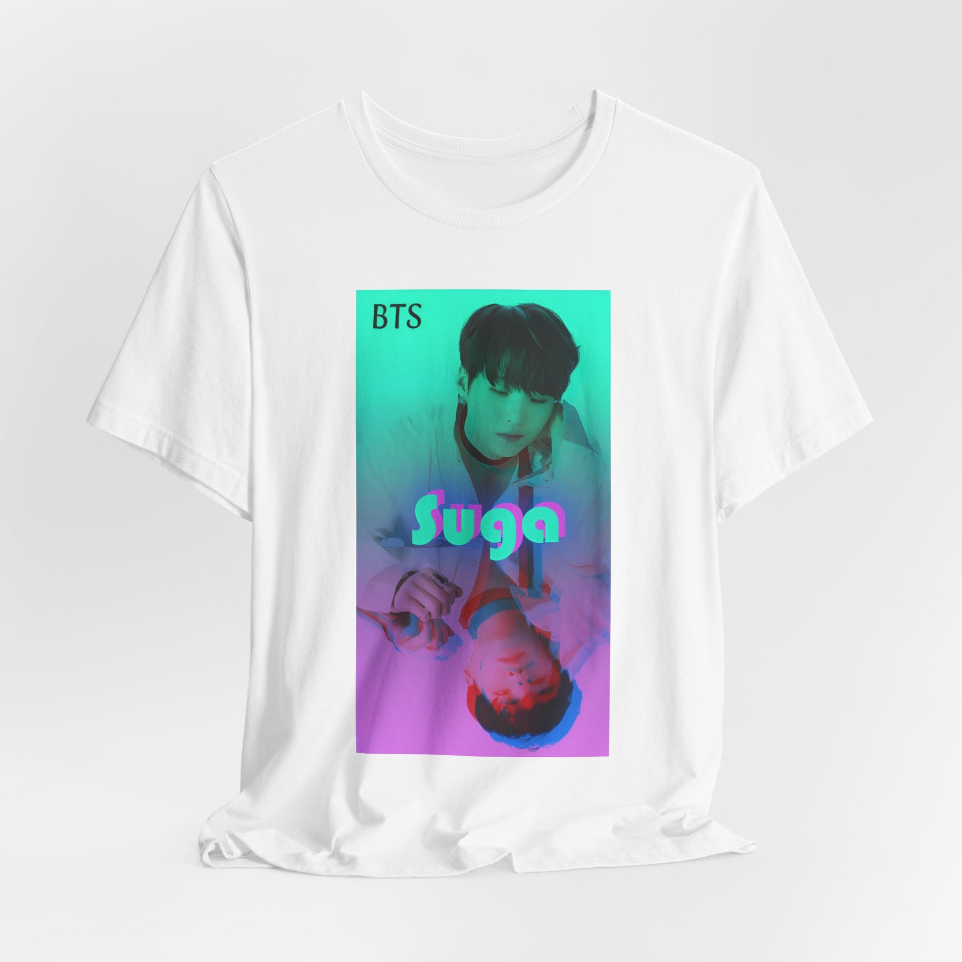 Draped Unisex airlume combed & ring-spun cotton T-shirt in white, featuring Suga of BTS (Agust D) in cyan, looking into a mirror. His lavender reflection appears glitched, starting at his right hand. The surreal gradient and distortion suggest a drifting, dreamlike moment out of sync with reality. From ModeK Vetements.