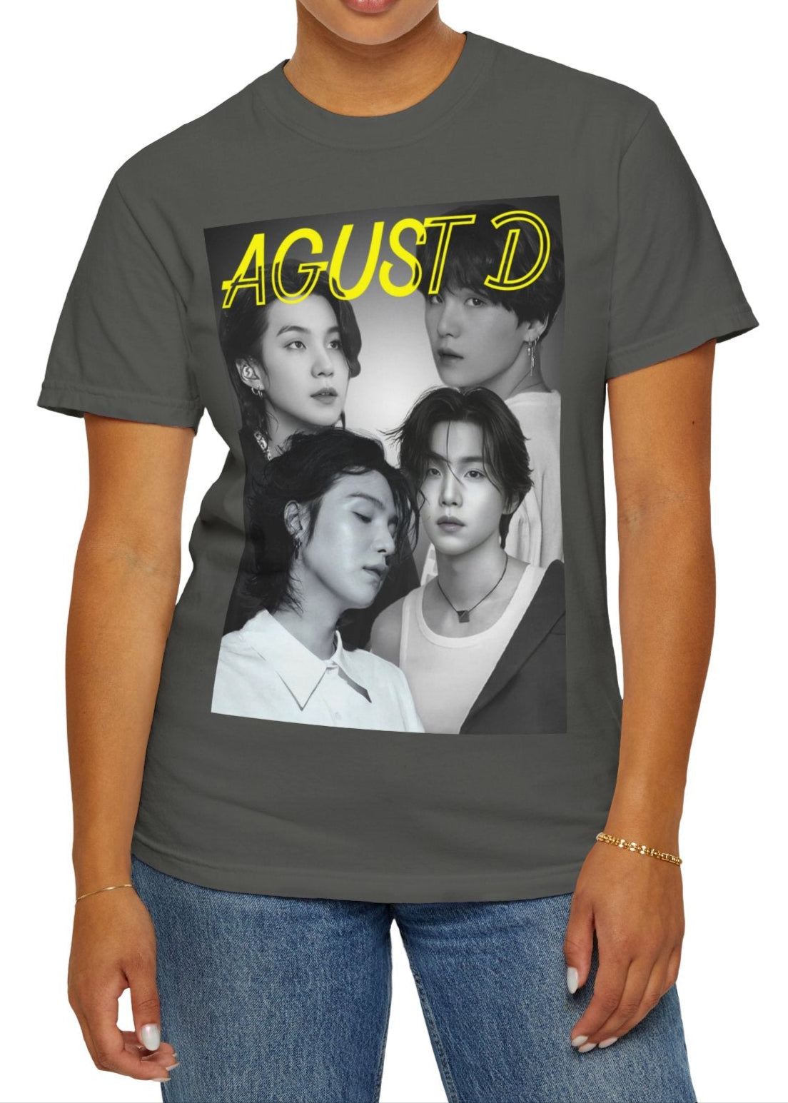 Agust D | SUGA BTS Unisex T-Shirt in pepper – Monochrome Collage. A bold black-and-white collage featuring multiple portraits of Agust D and SUGA, with a transparent-outlined text effect for a modern, artistic touch. ModeK Vetements.