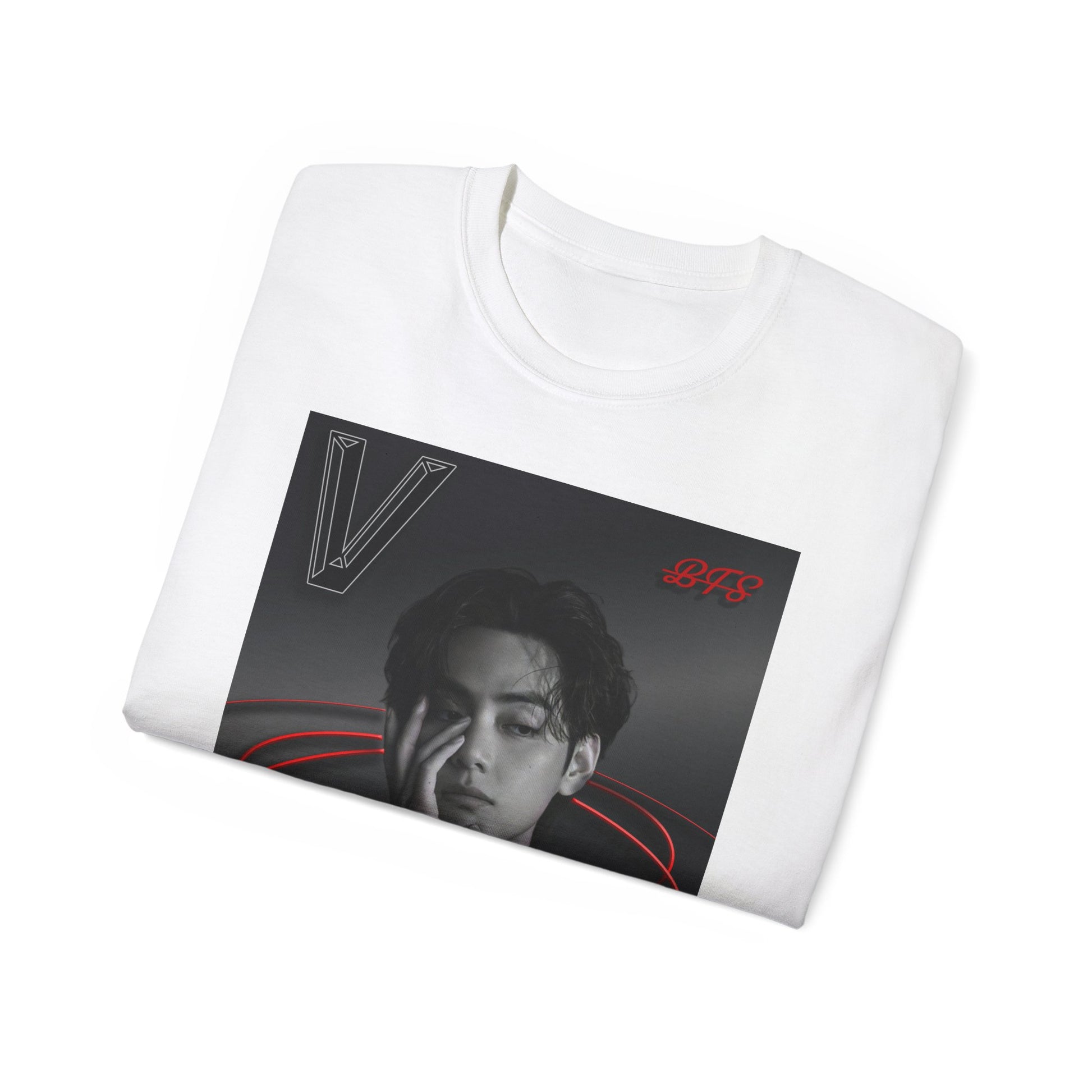 Folded, unisex 100% cotton T-shirt in white. The front of the shirt displays a high-contrast black-and-white portrait of K-pop star V (Kim Taehyung) looking forward with a contemplative expression. Encircling him are vibrant red, glowing 3D oval rings. A styled "V" appears in the top-left corner and a red "BTS" logo in the top-right corner. From ModeK Vetements.