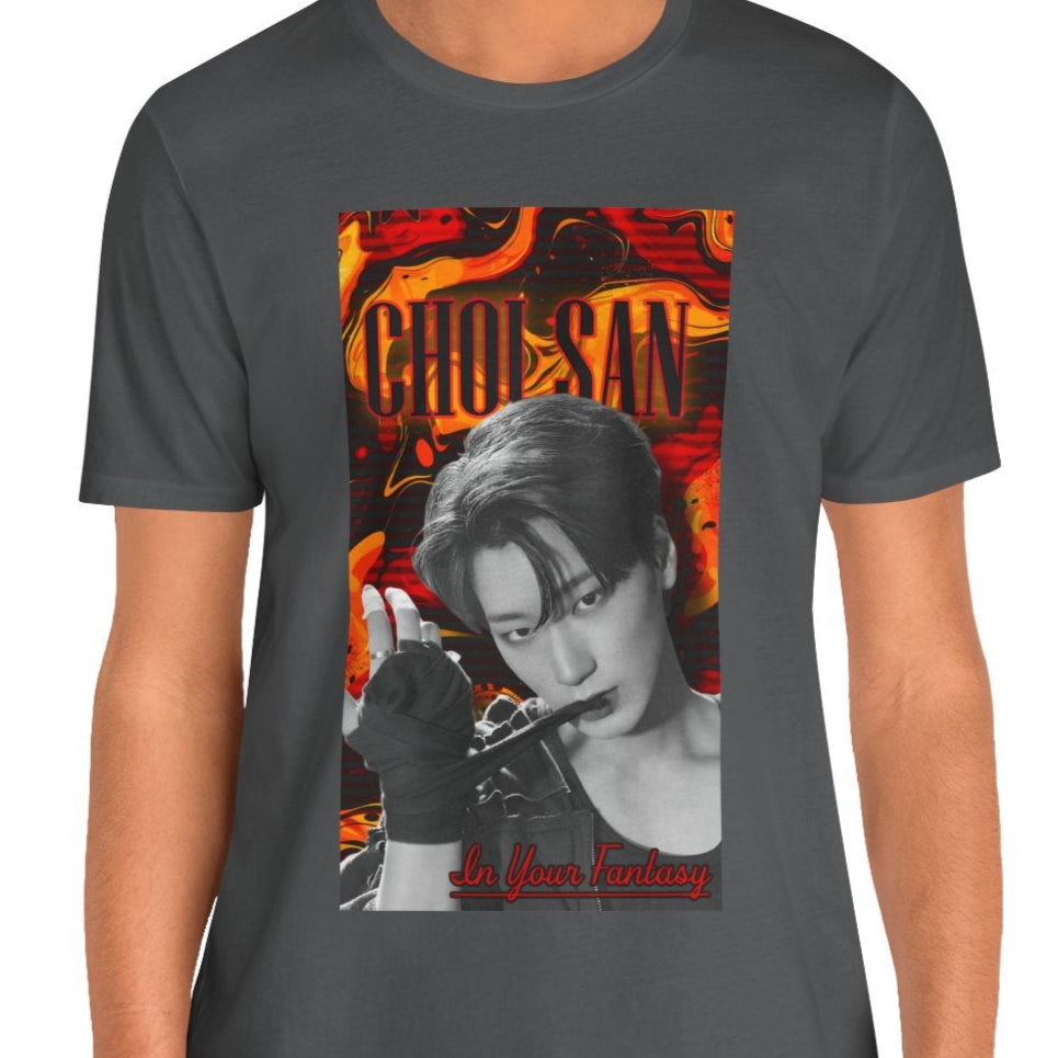 Unisex airlume cotton t-shirt in asphalt, featuring a Monochrome portrait of Choi San of ATEEZ biting a wrap, surrounded by glitch effects and a swirling Fire Engine Red and Gold Drop background. Red glowing text adds heat to the surreal, seductive atmosphere. From ModeK Vetements.