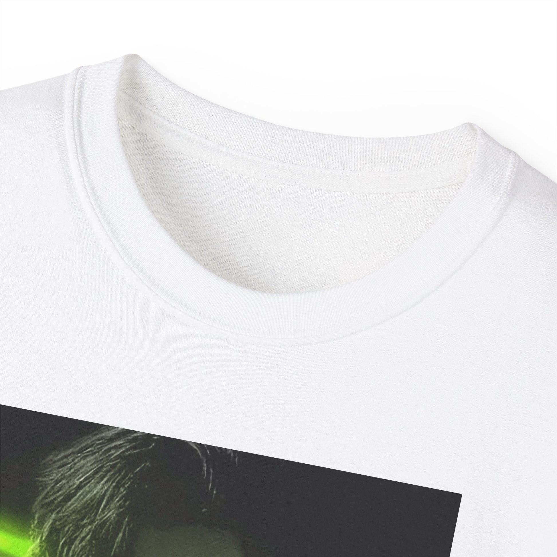 Closeup on the neckline of the Choi San ATEEZ unisex cotton t-shirt in white, featuring a black-and-white portrait with a neon-inspired green triangle behind him. His hand touches the glowing edge. Printed on 100% US cotton, ethically made and Oeko-Tex certified. ModeK Vetements.
