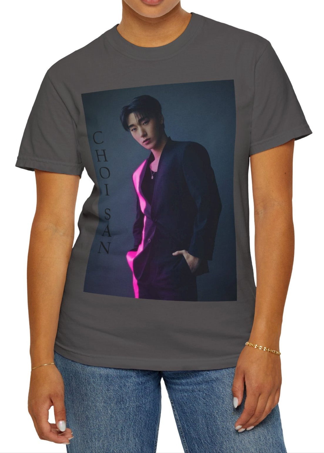 Choi San ATEEZ unisex T-shirt in graphite, featuring a striking neon pink line cutting through his sleek suit, set against cinematic shadows for a bold contrast. This high-impact design captures San’s poised presence and effortless charisma, printed on soft, breathable Airlume cotton for style and comfort. ModeK Vetements.