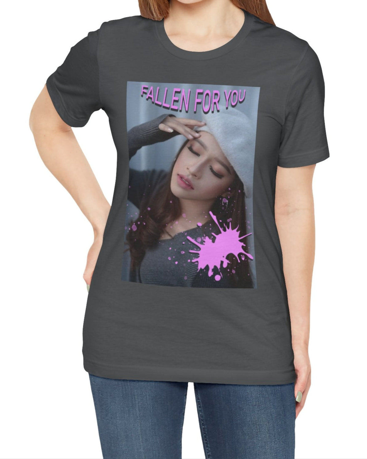 Unisex T-shirt in asphalt, featuring a dreamy photo of a woman with closed eyes, a soft expression, and a pink paint splash over her chest. The words “FALLEN FOR YOU” appear in bold pink lettering at the top. ModeK Vetements.