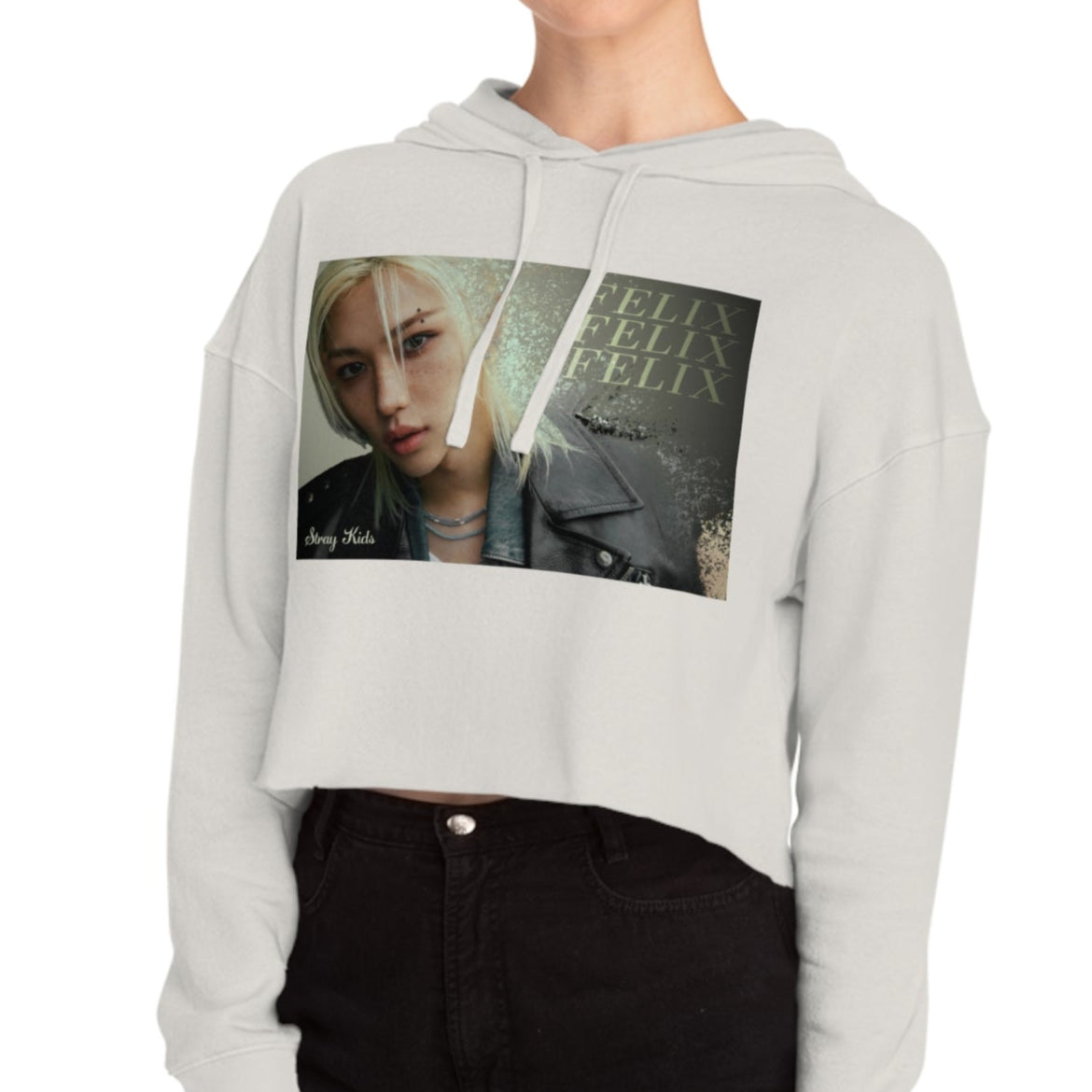 Felix Lee Stray Kids Unisex Cropped Hoodie in bone, featuring a soft gold gradient background, intense gaze, and sleek leather jacket. The dust-like texture and Felix typography add an ethereal, charismatic touch. Made from a soft cotton blend with a relaxed cropped fit for comfort and style. From ModeKVetements.