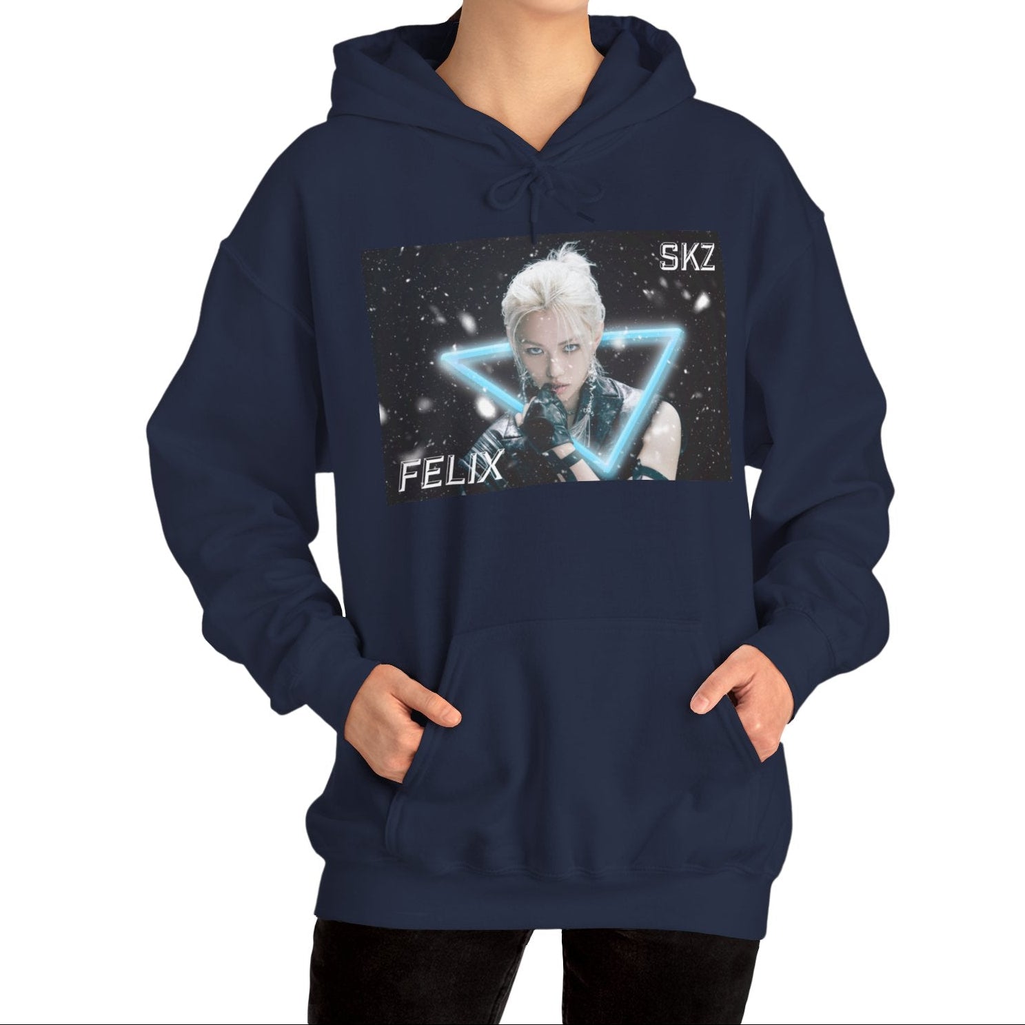 Unisex cotton-poly blend hoodie in navy, featuring a visual print of Felix from Stray Kids, framed by a glowing blue neon triangle amid falling snow on a dark background. From ModeK Vetements.
