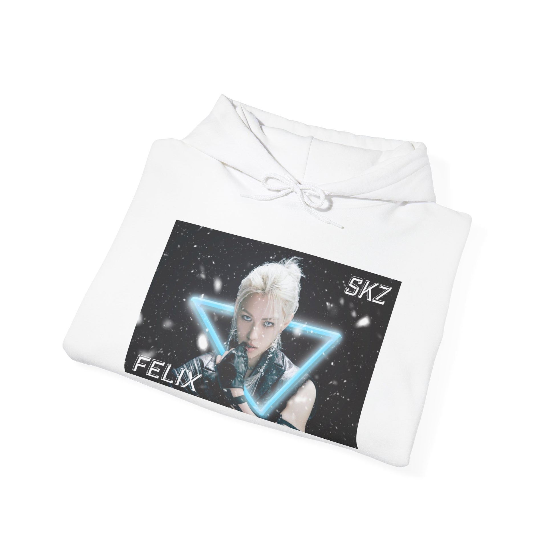 Folded Unisex cotton-poly blend hoodie in white, featuring a visual print of Felix from Stray Kids, framed by a glowing blue neon triangle amid falling snow on a dark background. From ModeK Vetements.