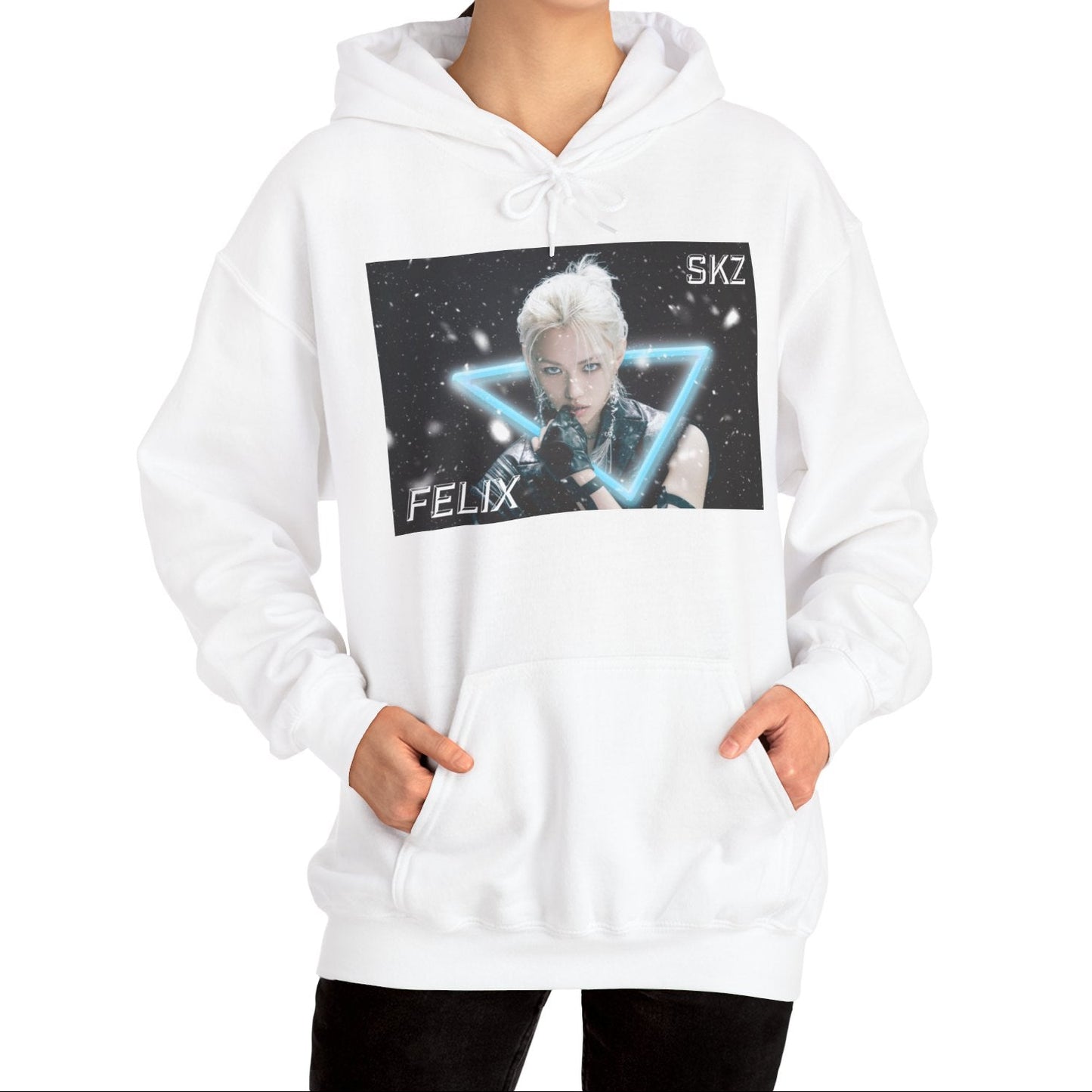 Unisex cotton-poly blend hoodie in white, featuring a visual print of Felix from Stray Kids, framed by a glowing blue neon triangle amid falling snow on a dark background. From ModeK Vetements.
