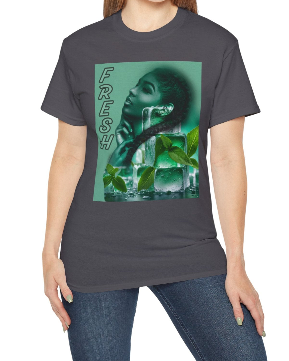 Unisex cotton t-shirt in charcoal, featuring a layered image of a woman behind translucent ice cubes with mint leaves. Her braid crosses in front of the cubes. Vertical “FRESH” lettering is outlined but empty, adding a floating, airy effect. Turquoise background. Printed on 100% US cotton, ethically made and Oeko-Tex certified. ModeK Vetements.