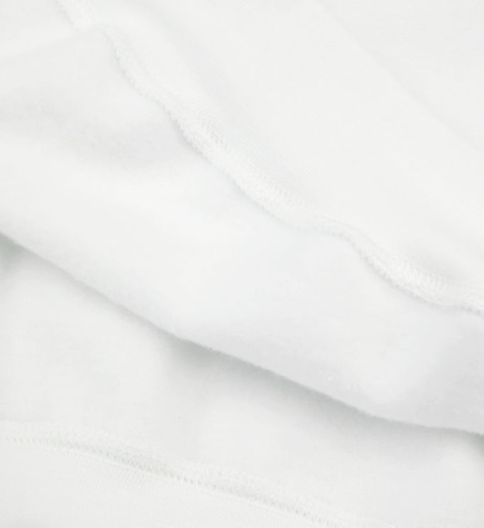 Close-up of the brushed interior of the 3-end fleece sweatshirt, featuring a soft cotton face and plush interior. Made from 80% ring-spun cotton and 20% polyester. — From ModeK Vetements