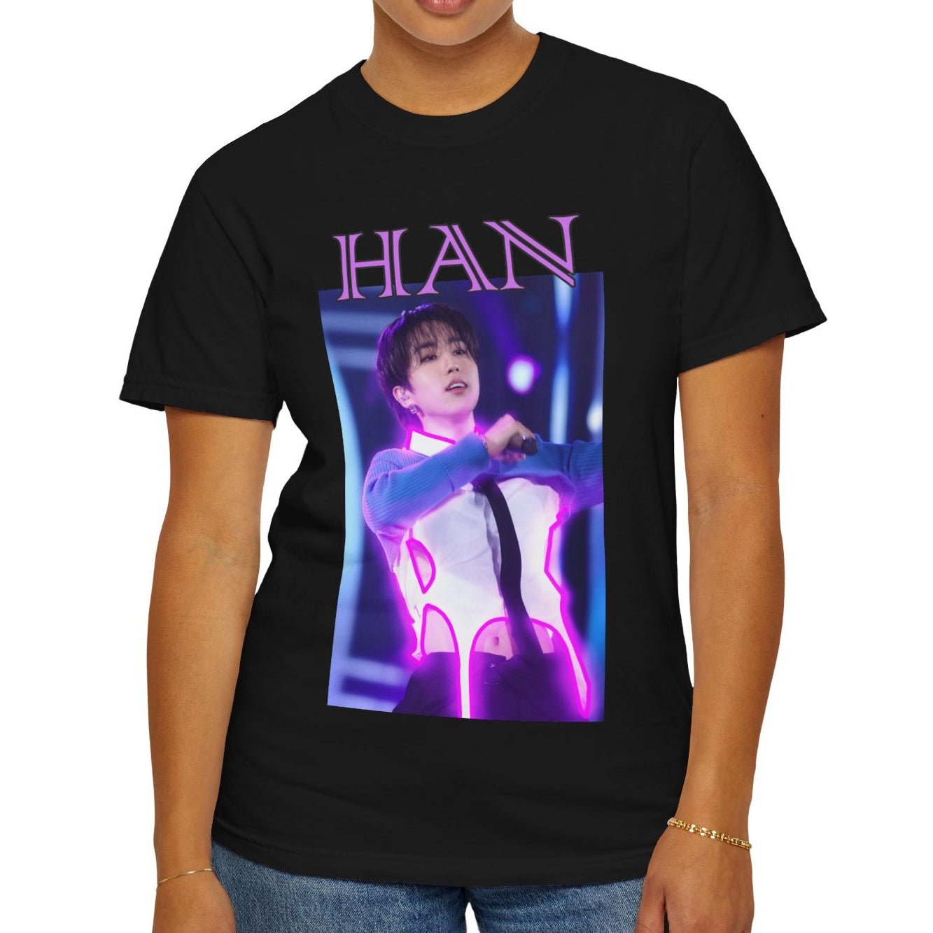 Han Stray Kids Unisex T-Shirt in black – Neon Energy. A striking design featuring Han performing on stage, outlined in bold pink neon lights. The glowing effect adds a futuristic, high-energy feel, capturing his electrifying stage presence. 100% ring-spun cotton from ModeK Vetements.