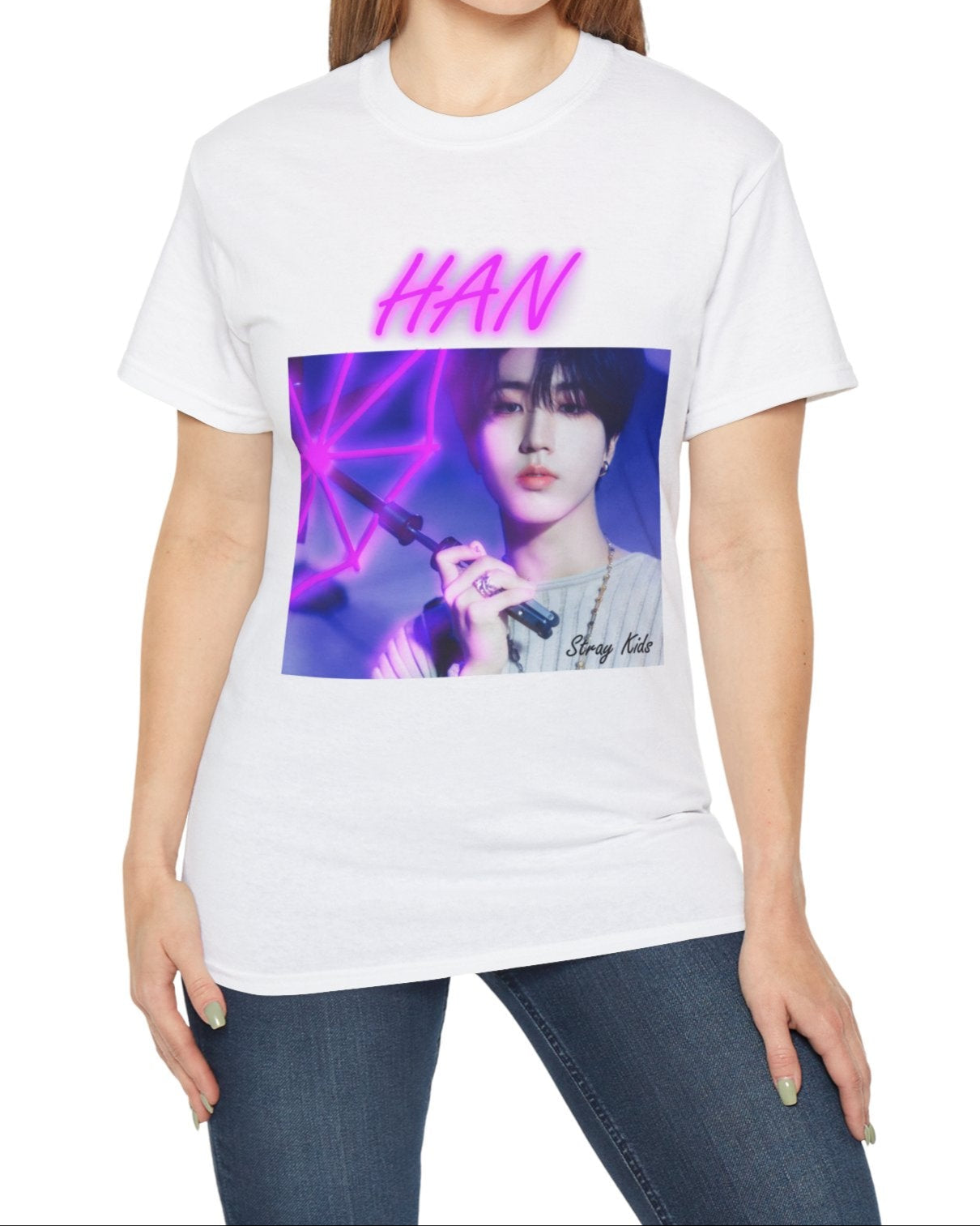 Han Stray Kids unisex T-shirt in white, featuring a vivid pink neon umbrella design. Han poses in soft lighting, blending calm intensity with futuristic K-pop energy. ModeK Vetements.