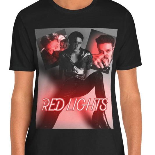 A black-and-white collage of Hyunjin set against a dramatic red neon glow, featured on a unisex black t-shirt from 100% Airlume combed and ring-spun cotton. The design captures the sultry and hypnotic energy of his track "Red Lights," with moody lighting and bold composition, making it a statement piece for fans. From ModeK Vetements.