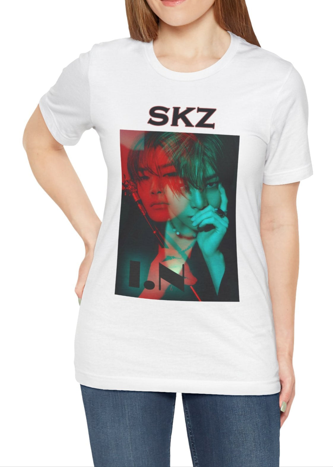 I.N Stray Kids unisex T-shirt in white, featuring a bold black-and-white portrait with a dual-tone red and teal overlay. The striking 3D-like effect, combined with "SKZ" typography and I.N’s name, creates a modern, edgy aesthetic. Made from 100% Airlume cotton for lightweight comfort. From ModeKVetements.