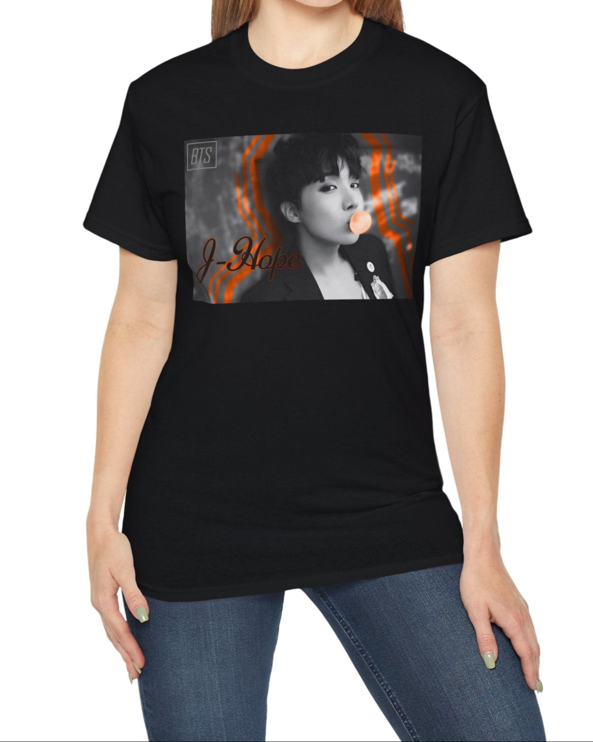 Black-and-white portrait of J-Hope of BTS blowing peach bubblegum, accented with bold deep orange contour lines — playful and bold design on a unisex cotton T-shirt in black. ModeK Vetements.