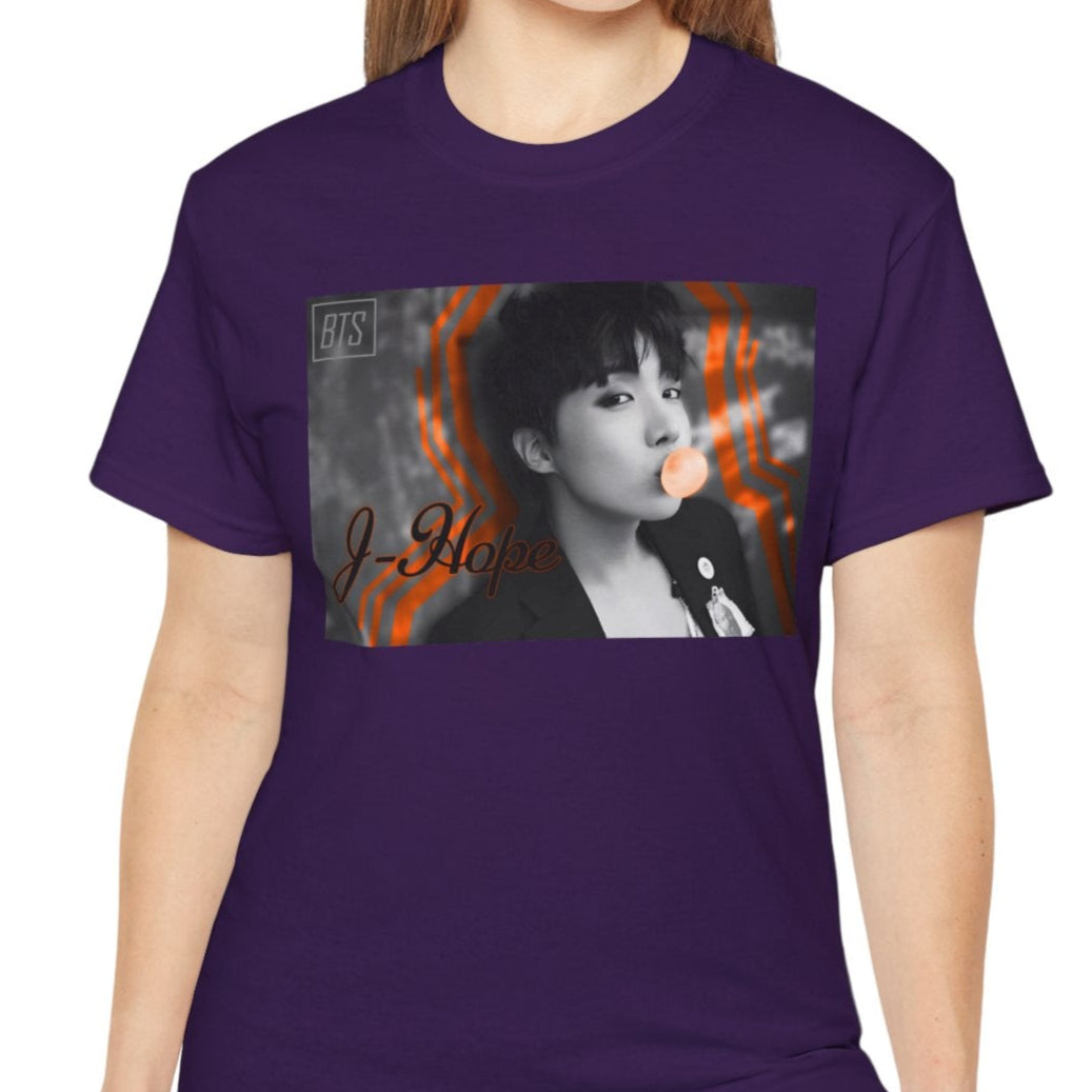 Black-and-white portrait of J-Hope of BTS blowing peach bubblegum, accented with bold deep orange contour lines — playful and bold design on a unisex cotton T-shirt in purple. ModeK Vetements.