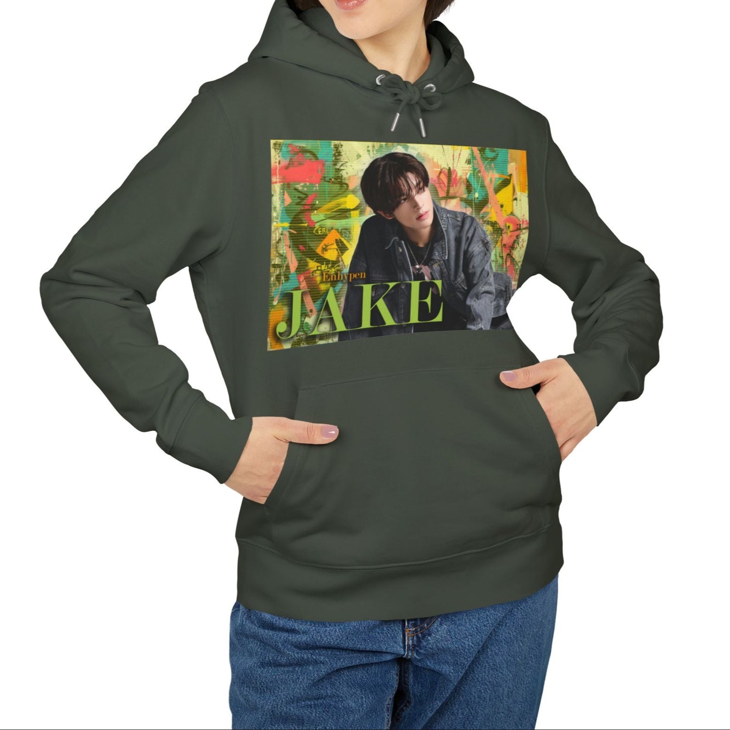 Unisex 100% Cotton Hoodie in khaki, featuring Jake of ENHYPEN framed in a layered pastel graffiti-style background, with calm expression and denim styling, surrounded by scanline textures. From ModeK Vetements.