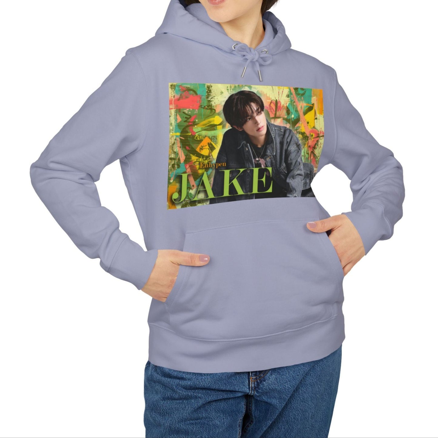 Unisex 100% Cotton Hoodie in lavender, featuring Jake of ENHYPEN framed in a layered pastel graffiti-style background, with calm expression and denim styling, surrounded by scanline textures. From ModeK Vetements.