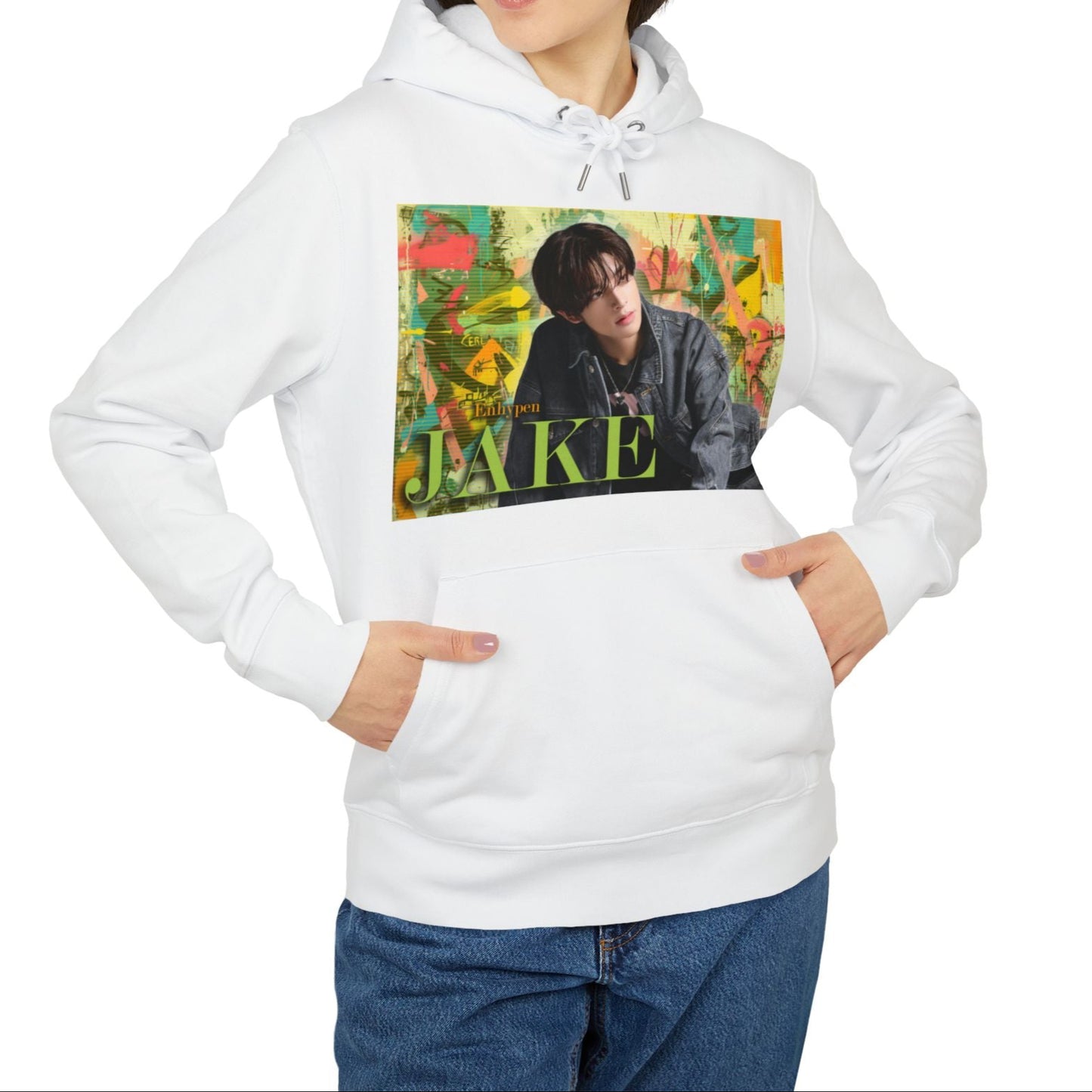 Unisex 100% Cotton Hoodie in white, featuring Jake of ENHYPEN framed in a layered pastel graffiti-style background, with calm expression and denim styling, surrounded by scanline textures. From ModeK Vetements.