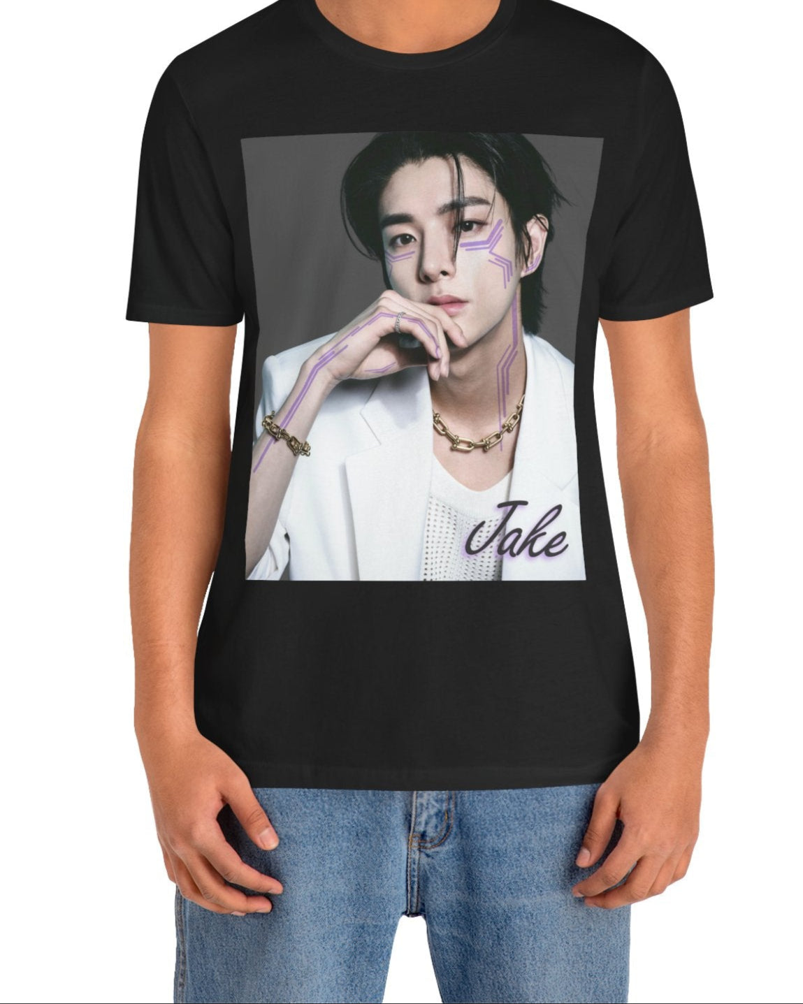 Unisex airlume cotton T-shirt in black, featuring a print of Jake from ENHYPEN wearing a white jacket with notch lapels and a mesh knit shirt, adorned with bold gold chains and delicate light wisteria circuit-like tattoos emphasizing his cheekbones and jawline. ModeK Vetements.