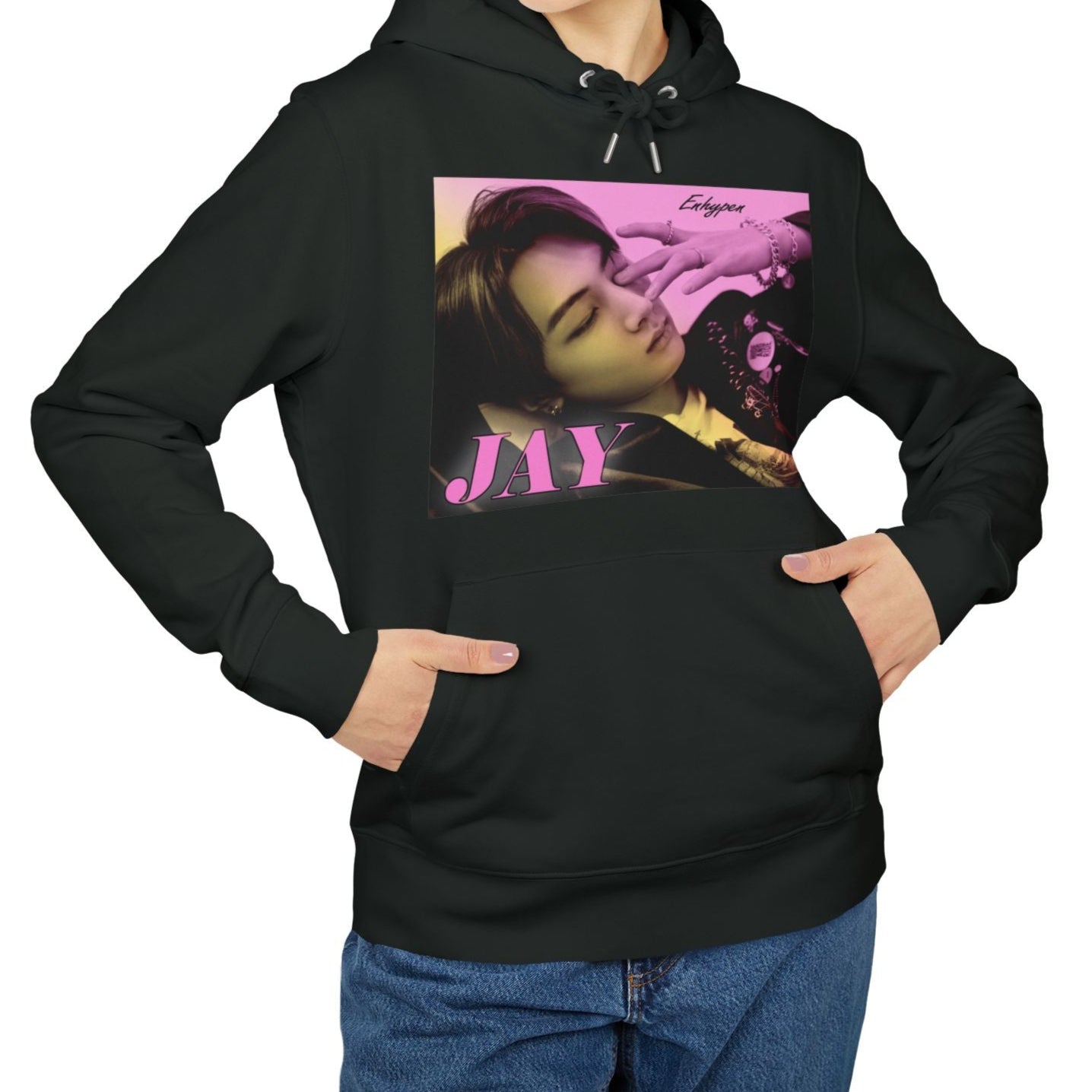 Jay from ENHYPEN on a unisex hoodie in black, with a soft gradient from lavender rose to jasmine. Serene, dreamy pose with safety pins, rings, and chains. From ModeKVetements.