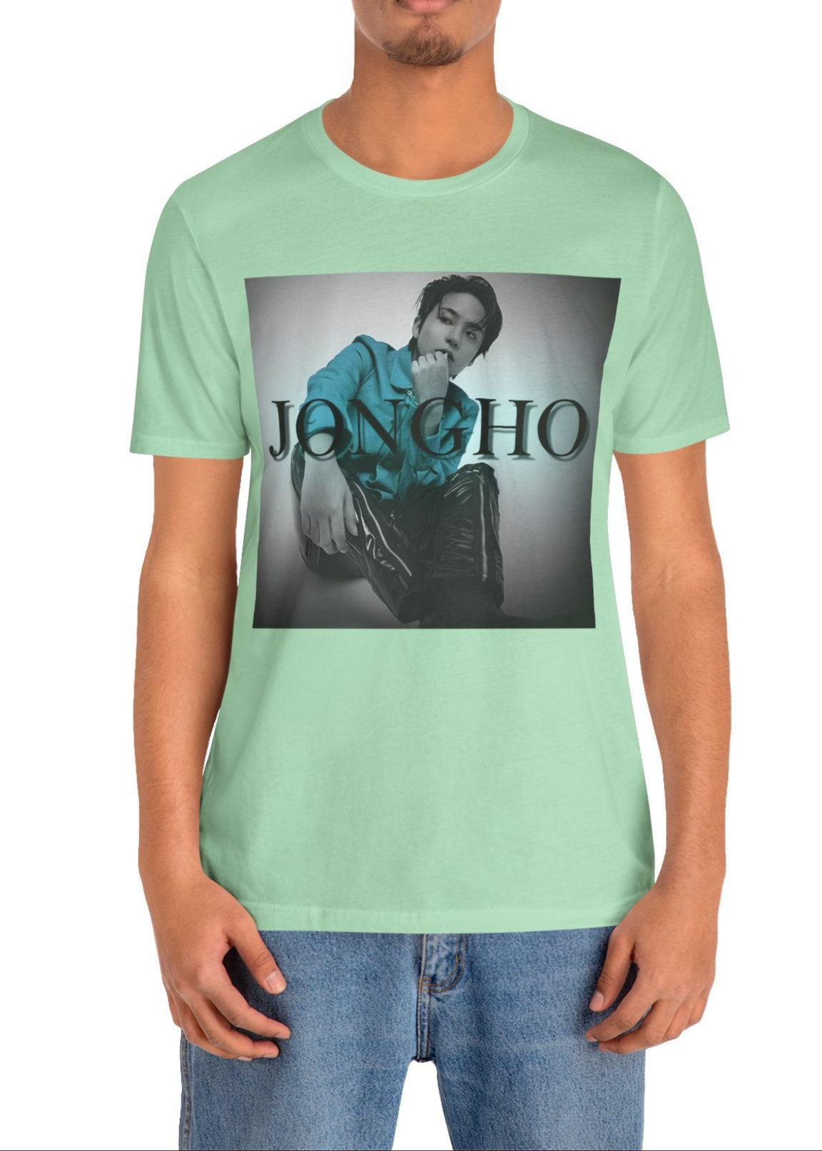 Jongho ATEEZ Unisex T-Shirt in mint, featuring a bold teal contrast against a monochrome backdrop. His unwavering gaze and strong posture exude quiet strength. ModeK Vetements.