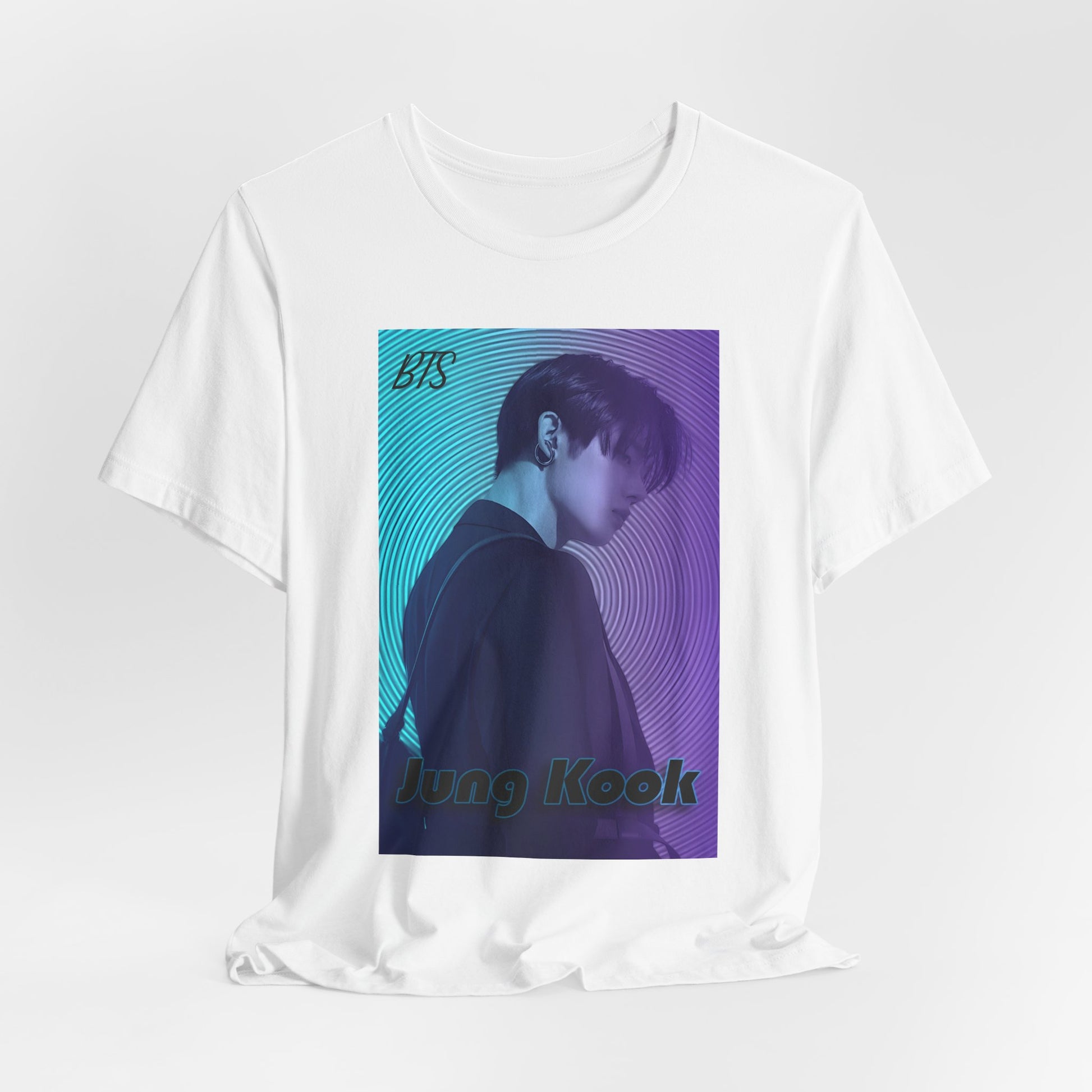 Jung Kook BTS draped T-shirt in white, featuring a cyan-to-lavender gradient, vinyl-inspired circular background, retro lettering, and profile portrait with suit and leather bag – cinematic unisex style. 100% Airlume combed and ringspun cotton. ModeK Vetements.