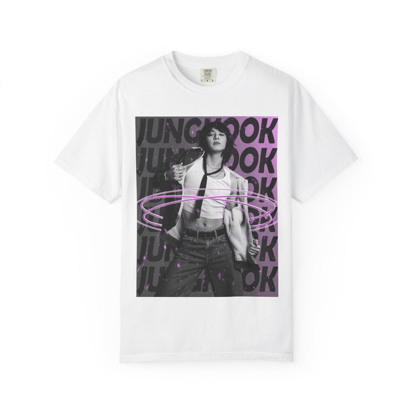 Draping unisex 100% ring-spun cotton T-Shirt in white, featuring BTS's Jungkook. He is posing against a dark background with "JUNGKOOK" repeated in large black typography and a charcoal-lavender gradient with pink paint splatters. Three glowing, thin magenta hoops encircle his waist, creating a sense of motion, making him even more provocative. From ModeK Vetements.