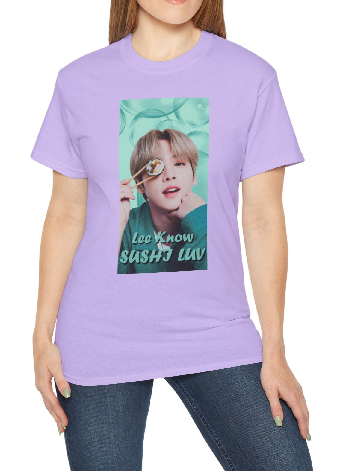 Lee Know Stray Kids Unisex T-Shirt in orchid, featuring a playful design with him holding sushi near his eye. The soft mint-green aesthetic enhances his charming and mischievous vibe. Printed on a high-quality cotton tee, available in XS-5XL. ModeK Vetements.