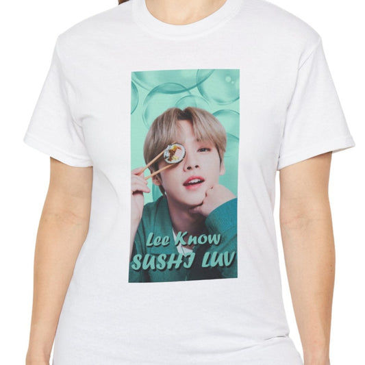 Lee Know Stray Kids Unisex T-Shirt in white, featuring a playful design with him holding sushi near his eye. The soft mint-green aesthetic enhances his charming and mischievous vibe. Printed on a high-quality cotton tee, available in XS-5XL. ModeK Vetements.