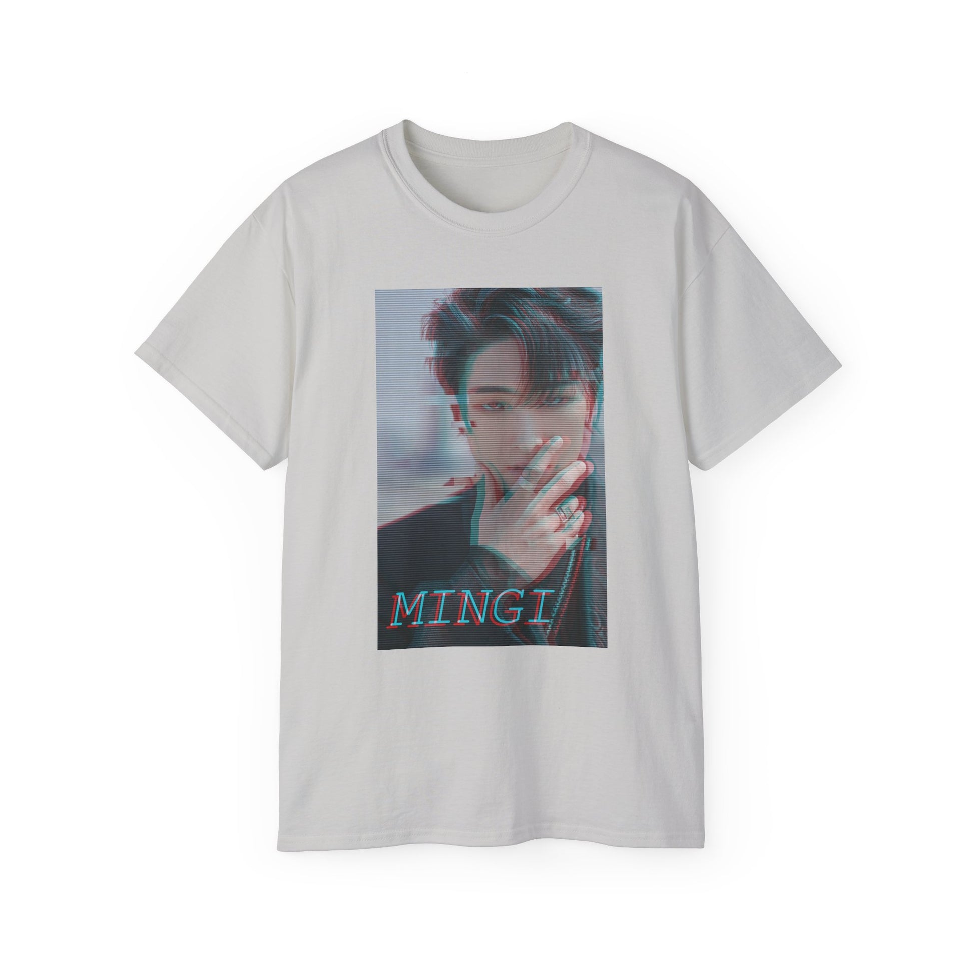 Draped Mingi ATEEZ T-shirt in ice grey, featuring a glitch anaglyph design in turquoise and carmine red with scan lines, showing a bold portrait with a piercing gaze and rebellious rings. From ModeK Vetements.