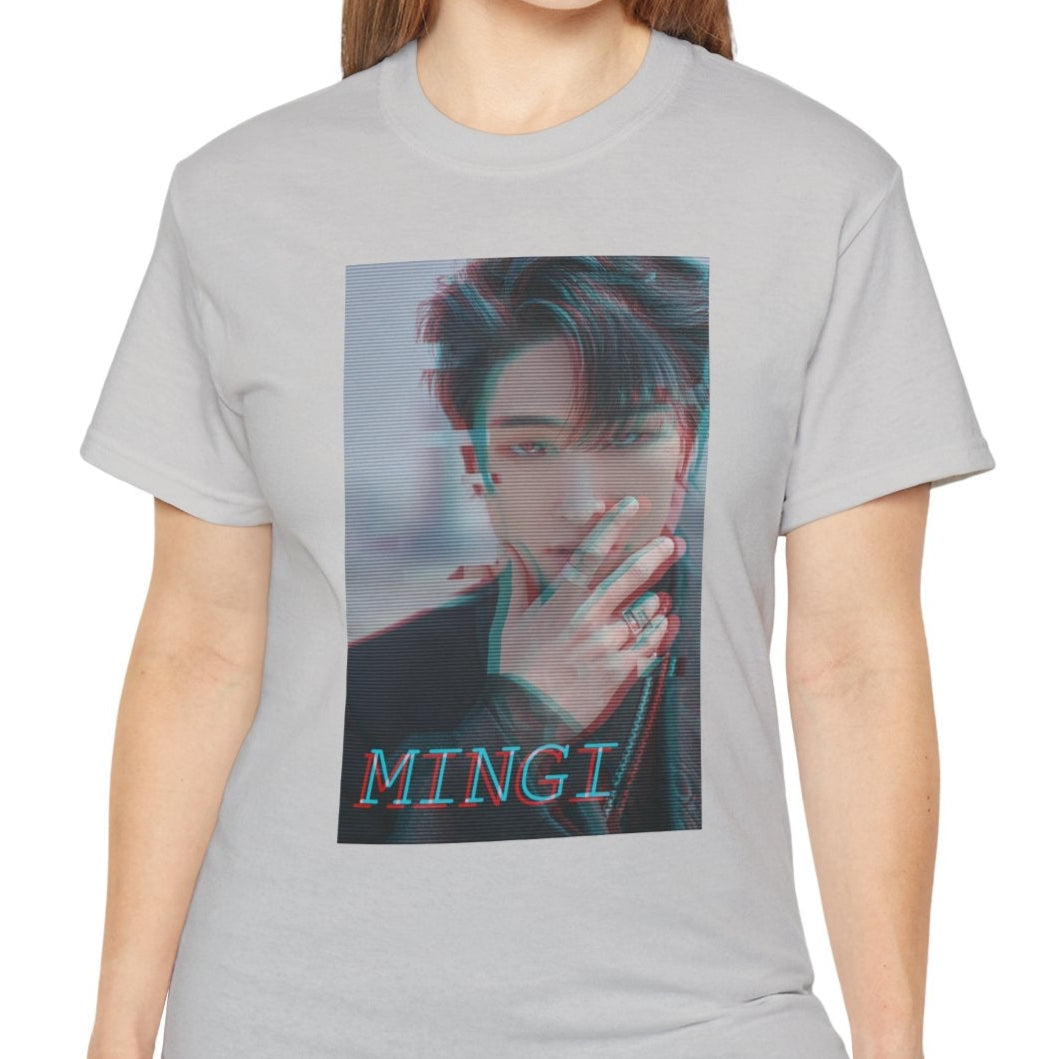 Mingi ATEEZ T-shirt in ice grey, featuring a glitch anaglyph design in turquoise and carmine red with scan lines, showing a bold portrait with a piercing gaze and rebellious rings. From ModeK Vetements.