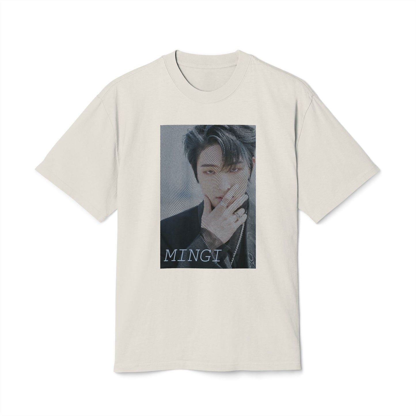 Draped Unisex boxy T-Shirt in faded bone, featuring a high-contrast graphic portrait of Mingi from the group ATEEZ, overlaid with a dense, wavy halftone moiré pattern. A fine black-and-white grid structure ripples across the image, distorting Mingi’s dark attire to create a powerful three-dimensional optical illusion of digital interference and textured depth. 100% carded cotton from ModeK Vetements.