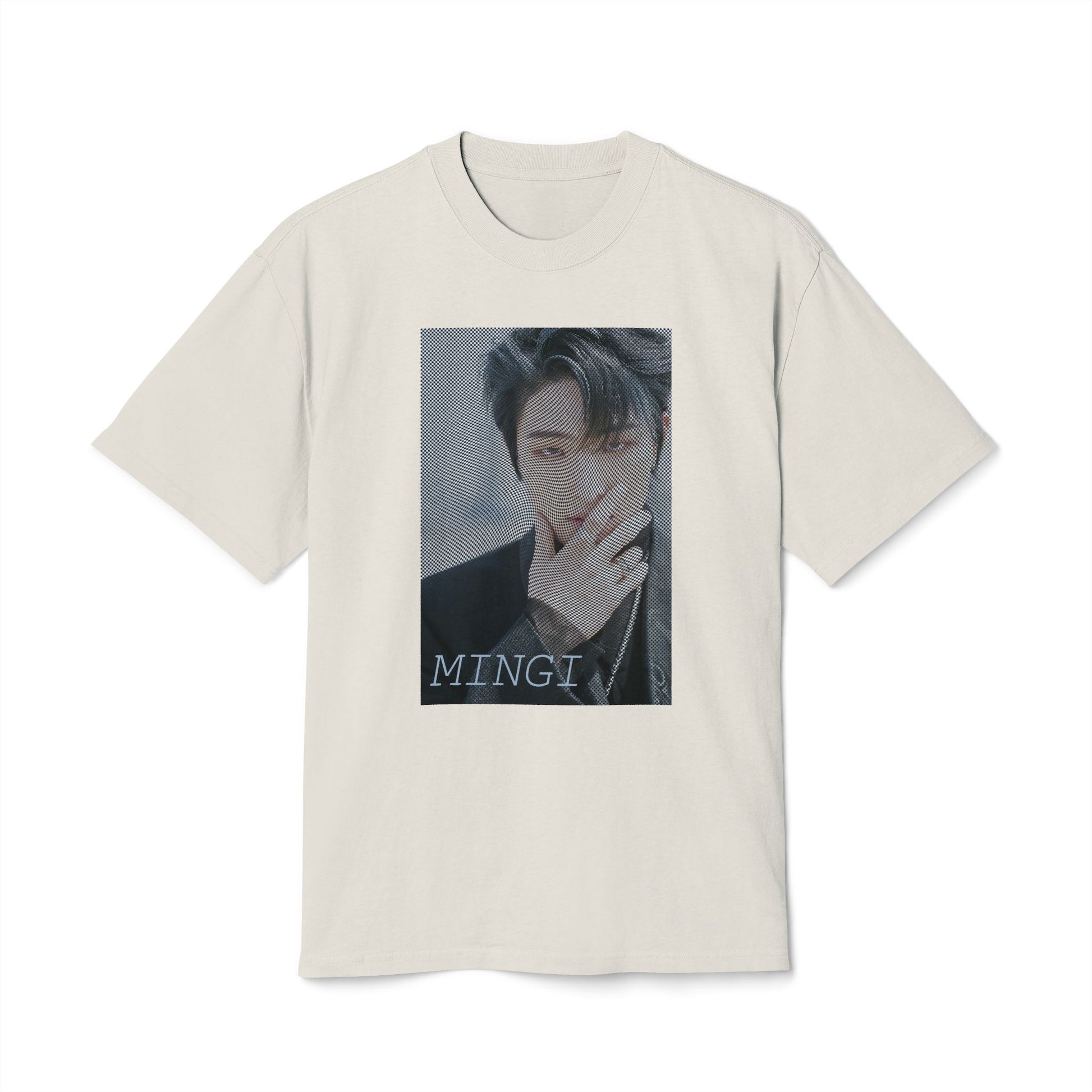 Draped Unisex boxy T-Shirt in faded bone, featuring a high-contrast graphic portrait of Mingi from the group ATEEZ, overlaid with a dense, wavy halftone moiré pattern. A fine black-and-white grid structure ripples across the image, distorting Mingi’s dark attire to create a powerful three-dimensional optical illusion of digital interference and textured depth. 100% carded cotton from ModeK Vetements.