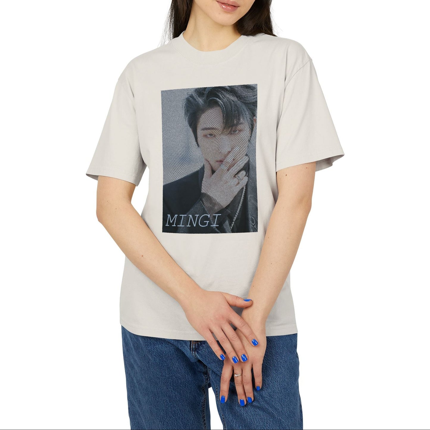 Unisex boxy T-Shirt in faded bone, featuring a high-contrast graphic portrait of Mingi from the group ATEEZ, overlaid with a dense, wavy halftone moiré pattern. A fine black-and-white grid structure ripples across the image, distorting Mingi’s dark attire to create a powerful three-dimensional optical illusion of digital interference and textured depth. 100% carded cotton from ModeK Vetements.