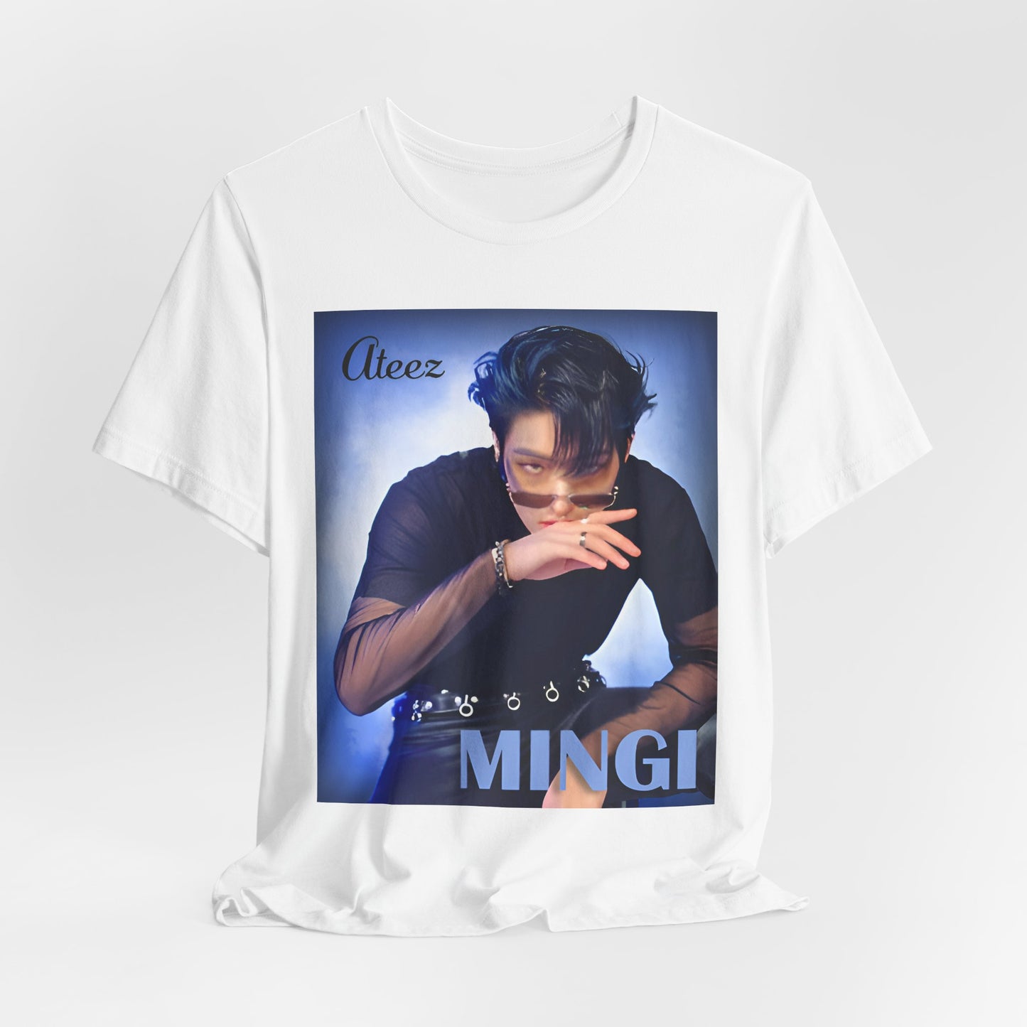 Draped Mingi ATEEZ Unisex T-Shirt in white, featuring a striking portrait of Mingi with a deep blue haze, sheer sleeves, and bold accessories. A statement of charisma and edge. ModeK Vetements.