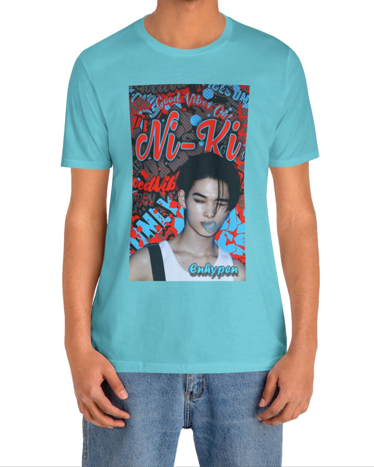 Unisex airlume cotton T-shirt in turquoise, featuring Ni-Ki of ENHYPEN layered into a bold graffiti-style design with Rosso Corsa red and Malibu Blue. The layout includes digital splashes, checkerboard effects, and a bubble gum moment frozen mid-pop. From ModeK Vetements.