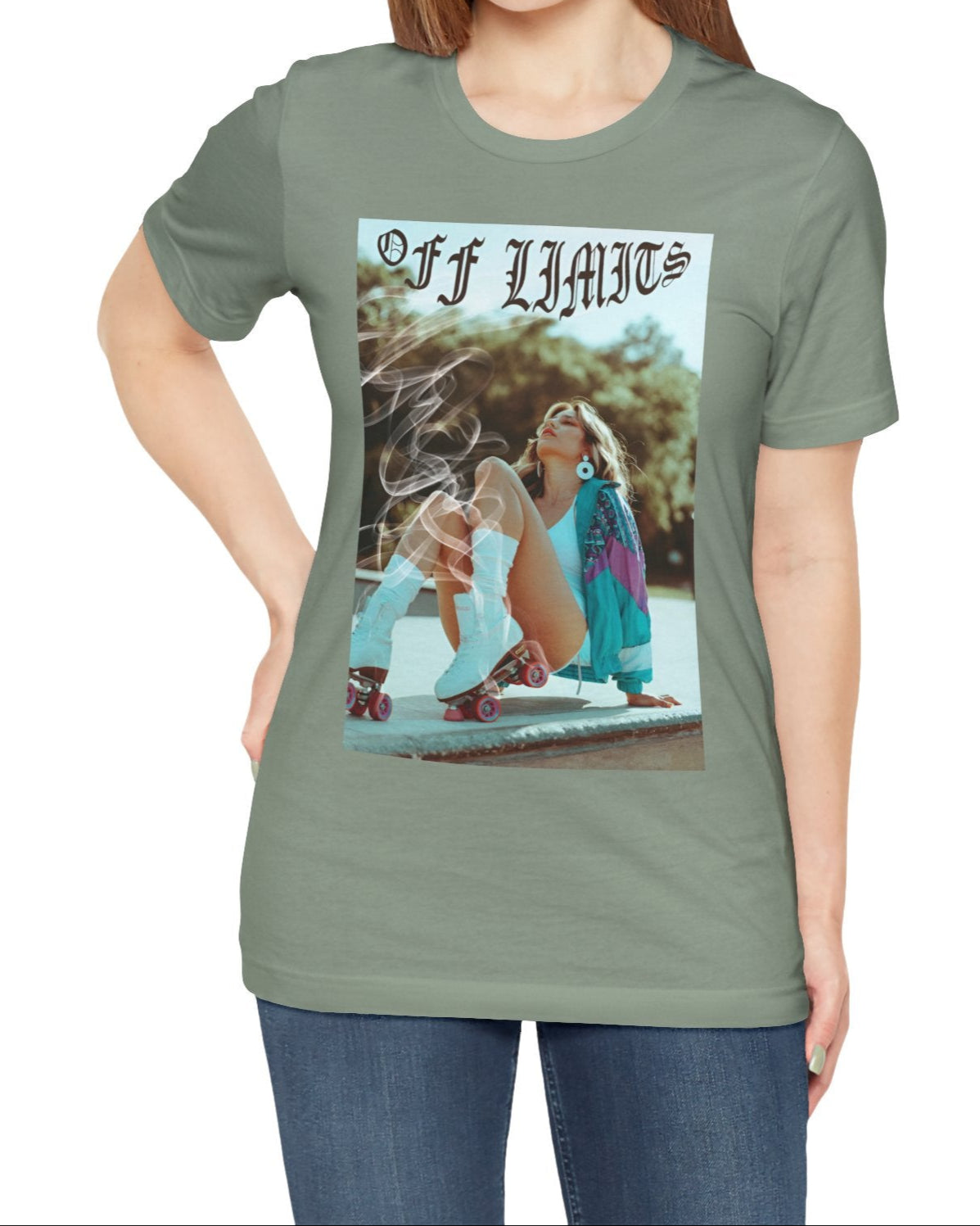 Unisex airlume cotton t-shirt in sage, featuring a woman in retro rollerblades with smoke rising from the wheels, resting confidently beneath "Off Limits" in bold gothic font - a statement of freedom and attitude. From ModeK Vetements.