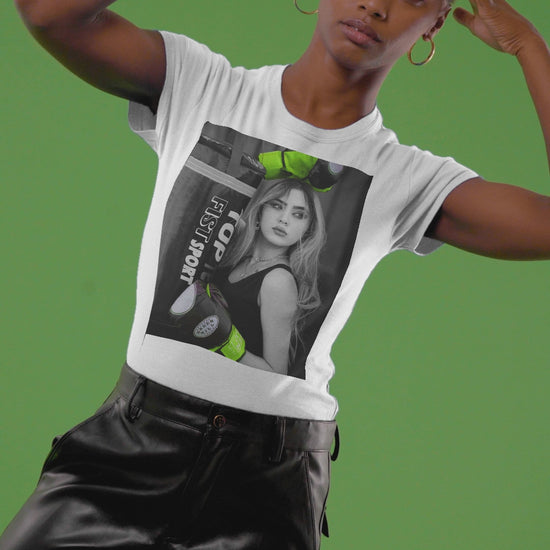 Video showcasing the Unisex t-shirt featuring a monochrome design of a woman with neon green boxing gloves. The bold contrast emphasizes her delicate features, blending strength and femininity. ModeK Vetements.