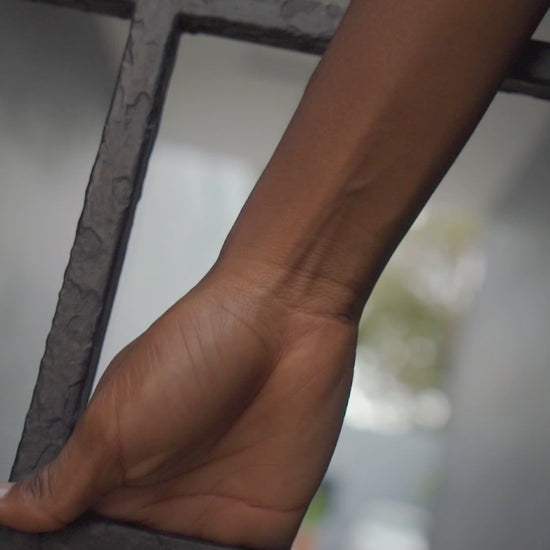 Video showcasing the Wooyoung Ateez unisex t-shirt in white, featuring the bold SIREN: No Escape design, with a background of newspaper headlines and chain-link fence. Printed on soft 100% US cotton and certified by OEKO-TEX for comfort and quality. ModeK Vetements.