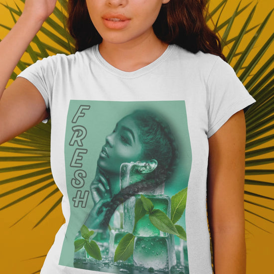 Video showcasing the Unisex cotton t-shirt in white, featuring a layered image of a woman behind translucent ice cubes with mint leaves. Her braid crosses in front of the cubes. Vertical “FRESH” lettering is outlined but empty, adding a floating, airy effect. Turquoise background. Printed on 100% US cotton, ethically made and Oeko-Tex certified. ModeK Vetements.