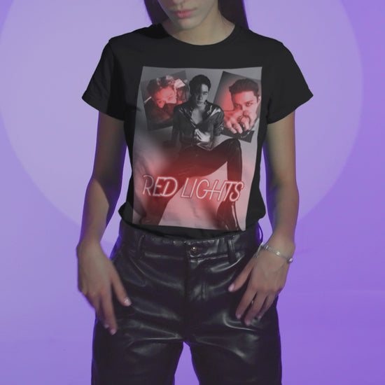 Video showcasing a black-and-white collage of Hyunjin set against a dramatic red neon glow, featured on a unisex t-shirt from 100% Airlume combed and ring-spun cotton. The design captures the sultry and hypnotic energy of his track "Red Lights," with moody lighting and bold composition, making it a statement piece for fans. From ModeK Vetements.