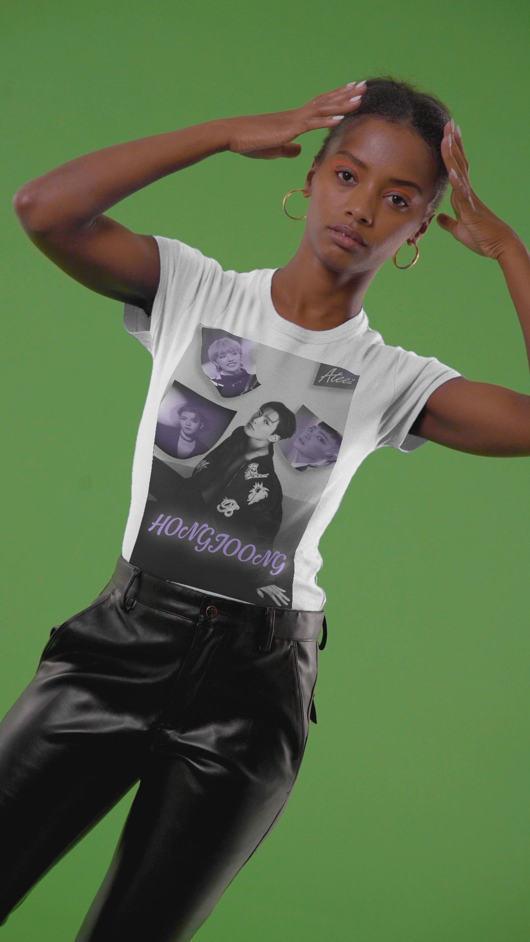 Video showcasing the Unisex cotton t-shirt in white, featuring a photo collage of Hongjoong from ATEEZ. The central image shows him seated in a black jacket with raised beaded embellishments—a snake and flowers—surrounded by soft violet portraits. The name "HONGJOONG" appears in purple script below the collage. ModeK Vetements.