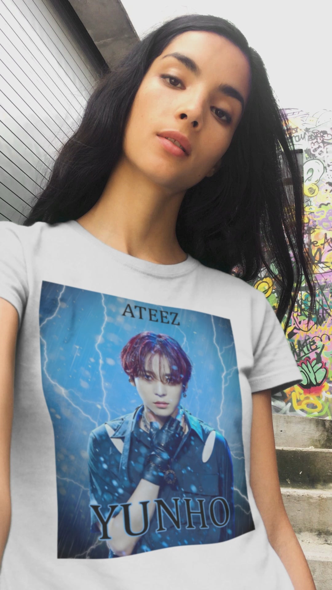 Video showcasing the Yunho ATEEZ unisex cotton t-shirt in white, featuring a stormy design with rain, lightning, red hair, leather glove, cut-out shoulder slits, and metal accessories. Printed on 100% US cotton, ethically made and Oeko-Tex certified. ModeK Vetements.