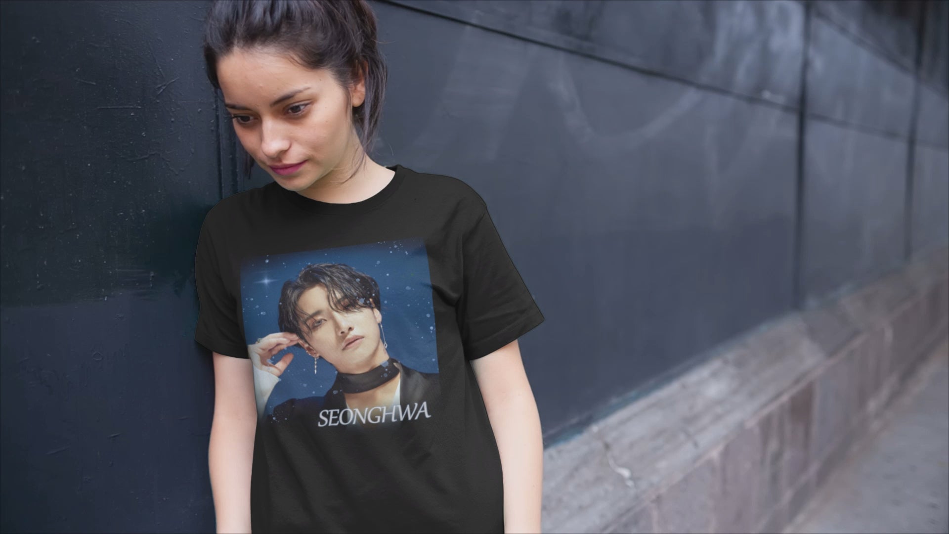 Video showcasing the Seonghwa ATEEZ unisex T-Shirt with a starry night aesthetic, featuring Seonghwa against a celestial sky with glowing stars. This K-pop t-shirt is perfect for ATEEZ fans who love cosmic and dreamy fashion. Printed on a high-quality cotton tee for comfort and style. ModeK Vetements.