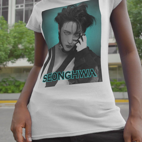 Video showcasing the Seonghwa ATEEZ Unisex T-Shirt in white – Experiment in Contrasts. A striking black-and-white portrait of Seonghwa with dramatic lighting, deep shadows, and a piercing gaze. His darkened lips add an intense edge, while a bold teal glow surrounds him, creating a contrast between elegance and raw energy. ModeK Vetements.
