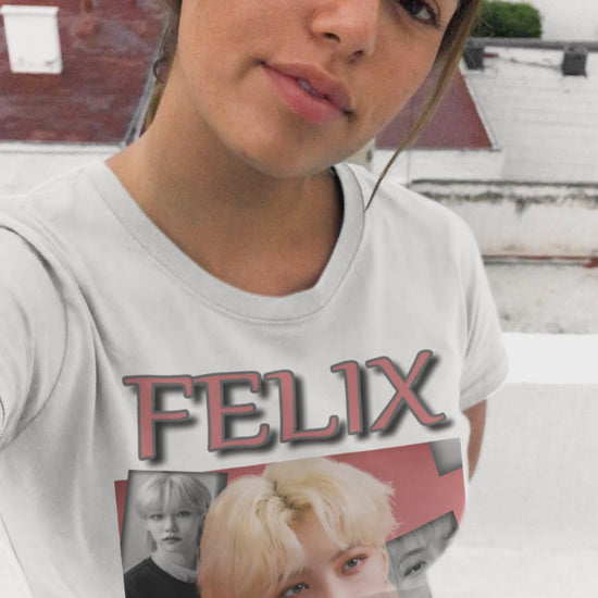 Video showcasing the Felix Stray Kids unisex T-shirt in white, with a blush pink and black-and-white collage design. Made from ethically sourced US cotton with a classic tubular knit construction. ModeK Vetements.