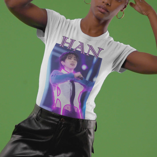 Video showcasing the Han Stray Kids Unisex T-Shirt in white – Neon Energy. A striking design featuring Han performing on stage, outlined in bold pink neon lights. The glowing effect adds a futuristic, high-energy feel, capturing his electrifying stage presence. 100% ring-spun cotton from ModeK Vetements.