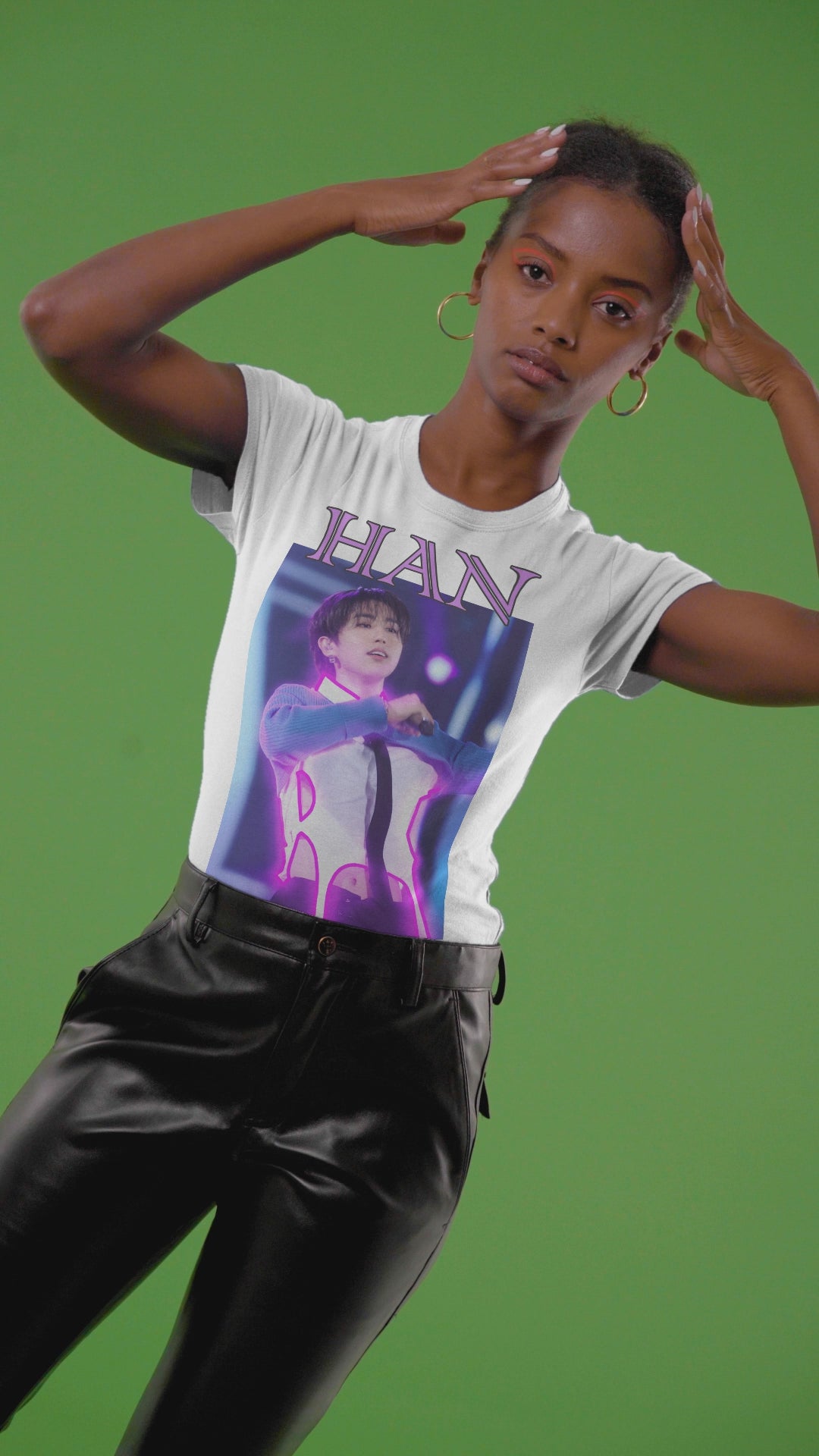 Video showcasing the Han Stray Kids Unisex T-Shirt in white – Neon Energy. A striking design featuring Han performing on stage, outlined in bold pink neon lights. The glowing effect adds a futuristic, high-energy feel, capturing his electrifying stage presence. 100% ring-spun cotton from ModeK Vetements.