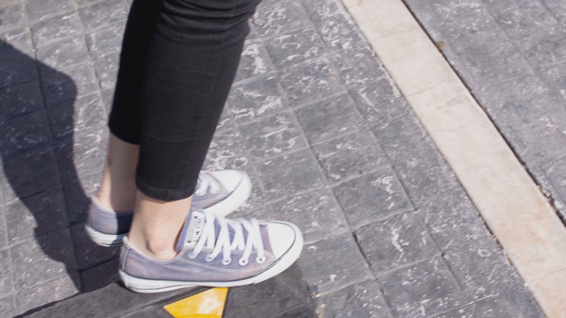Video showcasing the Yeosang ATEEZ graphic unisex t-shirt in white, with a black-and-white portrait featuring a torn-paper effect revealing a single colored strip with turquoise eyes and text. Yeosang is putting a hoodie over his head, creating a quiet, enigmatic presence. From ModeKVetements.